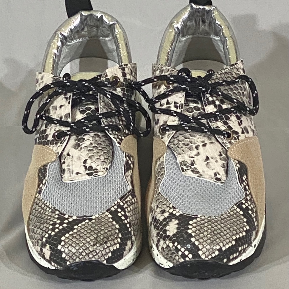 Outwood’s tennis shoes